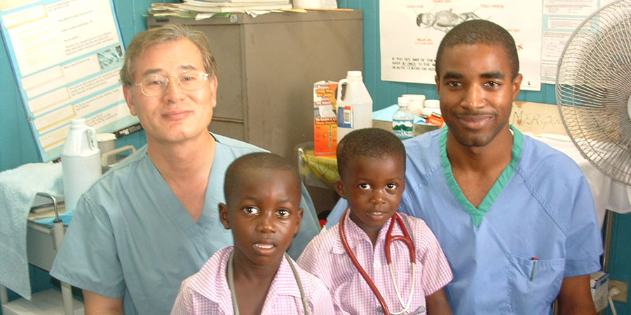 Doctor examining child at CHO mission