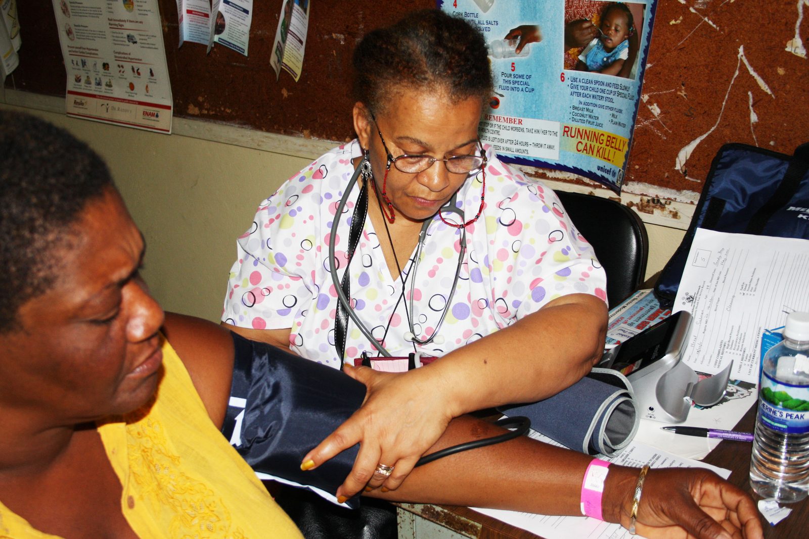 CHO blood pressure screening at mission clinic